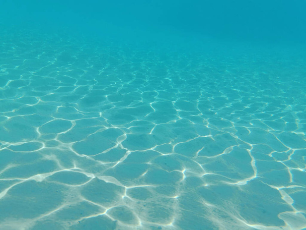 clear sand under sea water as nice background - Photo, Image