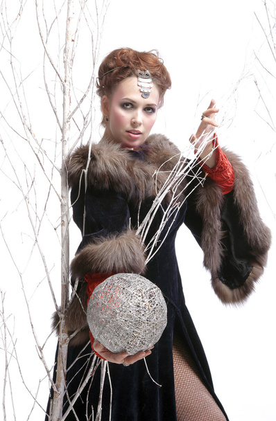 Girl in the character of a witch with ball - Photo, Image