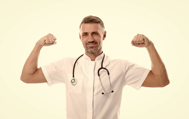 successful mature man therapist with phonendoscope in uniform isolated on white happy about good medical results, healthcare - Φωτογραφία, εικόνα