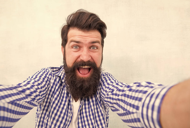 Happiness is everything. Happy hipster with beard keep mouth open. Bearded man feel happiness. Joy and pleasure. Experiencing positive emotions. Smiling and laughing. Holiday celebration. selfie - Foto, imagen