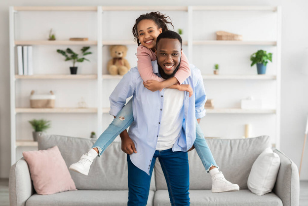 Portrait of black dad and daughter spending time at home - Photo, image