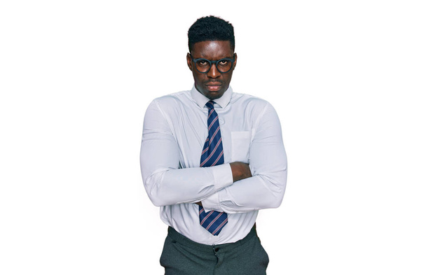 Handsome business black man wearing white shirt and tie skeptic and nervous, disapproving expression on face with crossed arms. negative person.  - Photo, Image