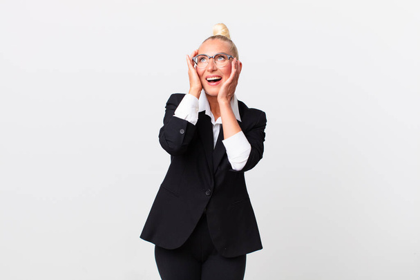 pretty blond woman feeling happy, excited and surprised. business concept - Fotoğraf, Görsel