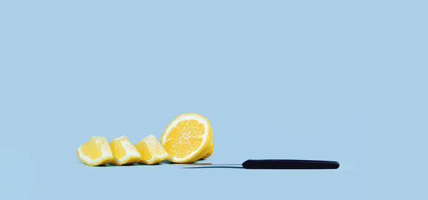 lemon cut into pieces and a knife on blue. Front view copy space. Healthy lifestyle, weight management and immune vitamin C boost hydration or smoothie concept - Foto, Imagen