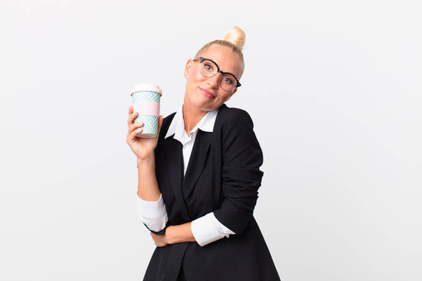 pretty blond adult businesswoman with a take away coffee - Fotoğraf, Görsel