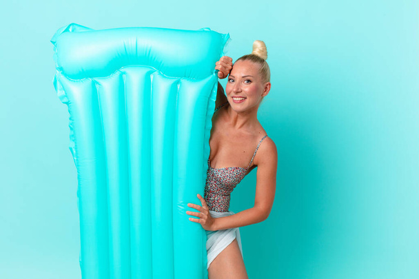 young pretty woman with a inflatable mattress. summer concept - Zdjęcie, obraz