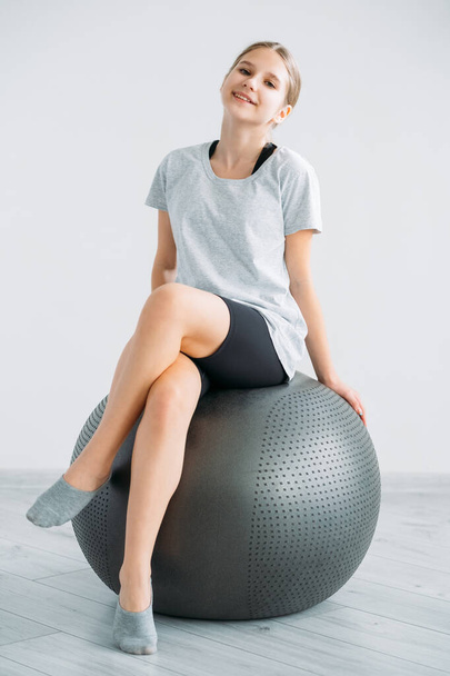 home gym equipment kid exercise girl balance ball - Фото, изображение