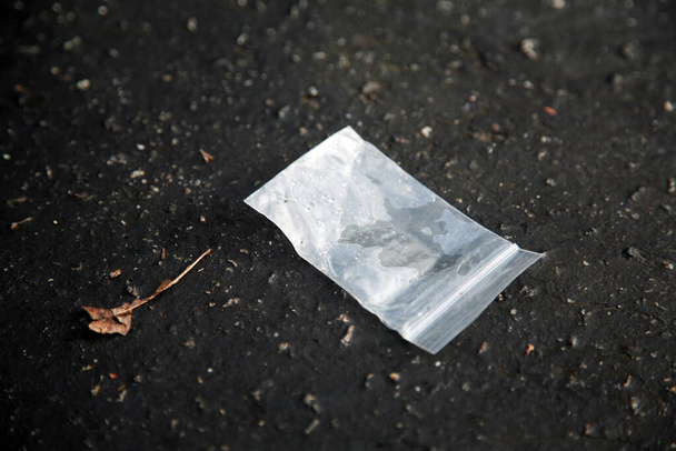 Drugs. Methamphetamine. cocaine. heroin. mdma. Illegal Drugs. Drug abuse. Drug package.    sealed packages from a polymeric film with drugs. drugs in the form of crystals on a black background. methamphetamine in a plastic bag. drug abuse. junkie. - 写真・画像