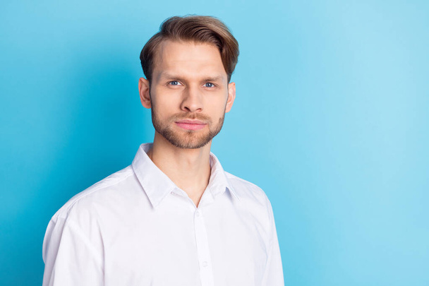 Photo of serious young calm man businessman wear white shirt isolated on pastel blue color background - Fotografie, Obrázek