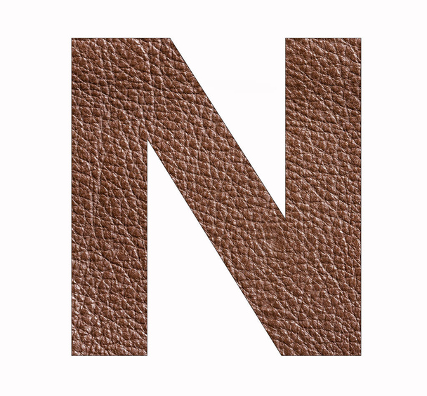 N uppercase alphabet letter - Brown leather texture background - Photo, Image