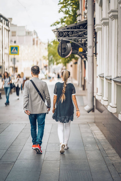 Abstract unrecognizable couple walking. Modern City life, love, lifestyle. Regular people out in public places - 写真・画像