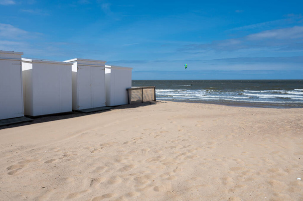 White beach huts on yellow sandy beaches in small Belgian town Knokke-Heist, luxury vacation destination, summer holidays - Photo, Image
