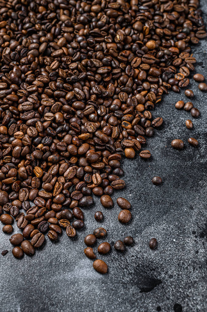 Roasted coffee beans on rustic table. Black background. Top view - Photo, Image