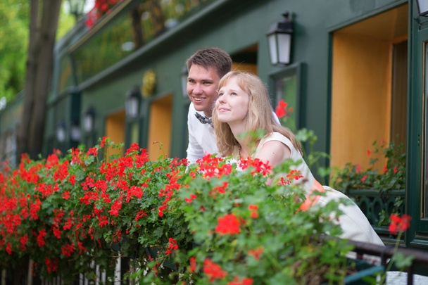 Happy young newly-wed couple on a balcony - Foto, Imagen