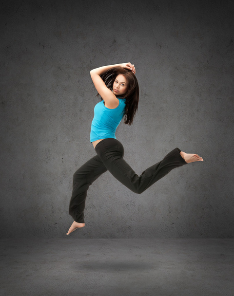 beautiful sporty woman jumping in sportswear - 写真・画像