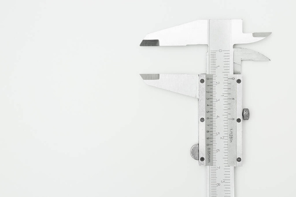 Top view of iron Vernier Calipers on white background and copy space - Photo, Image