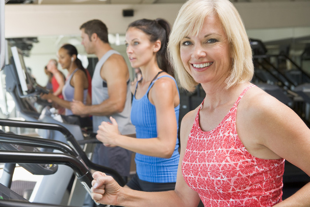 Woman Running On Treadmill At Gym - Zdjęcie, obraz
