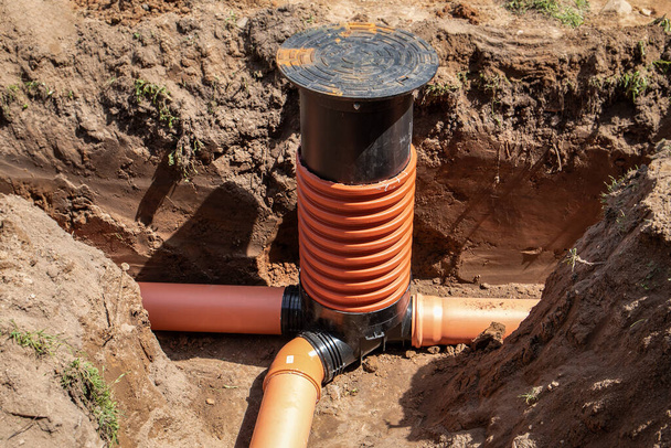 Sewage system. Plastic tubes and aka. Excavated trench or pit - Photo, Image
