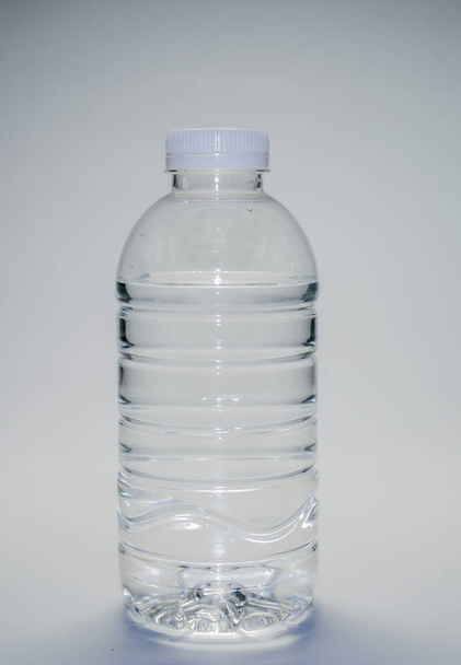 Clear plastic water bottle on a white background. plastic waste water bottle on white background - Valokuva, kuva