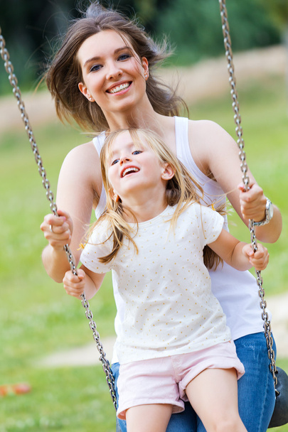 Mother and Daughter having fun outdoors - Foto, immagini