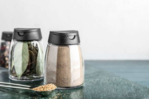 Jars with different spices on table - Foto, imagen
