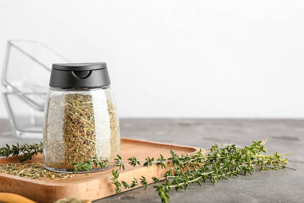 Composition with dried herbs and fresh thyme on table - Photo, image