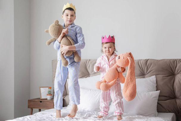 Cute little children with toys in bedroom - Photo, Image