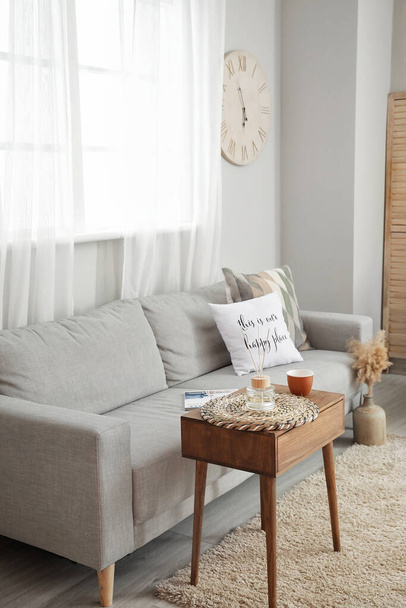 Interior of modern living room with cozy sofa - Φωτογραφία, εικόνα