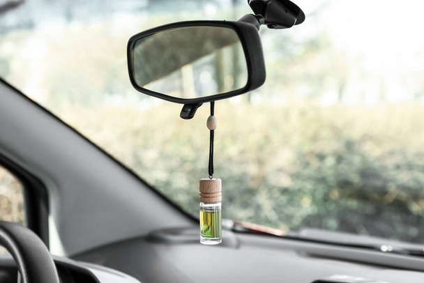 Air freshener hanging in car, closeup - Photo, Image