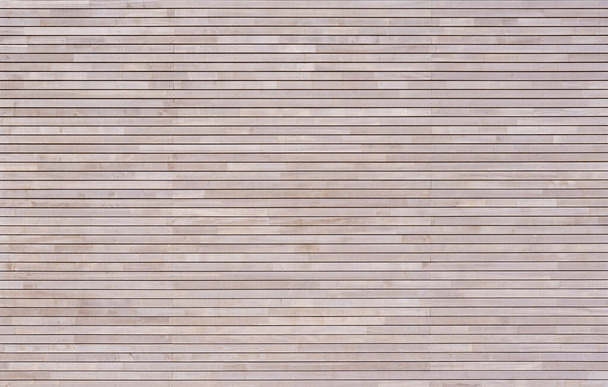 New modern bright wood cladding made of horizontal battens on a facade - Photo, image