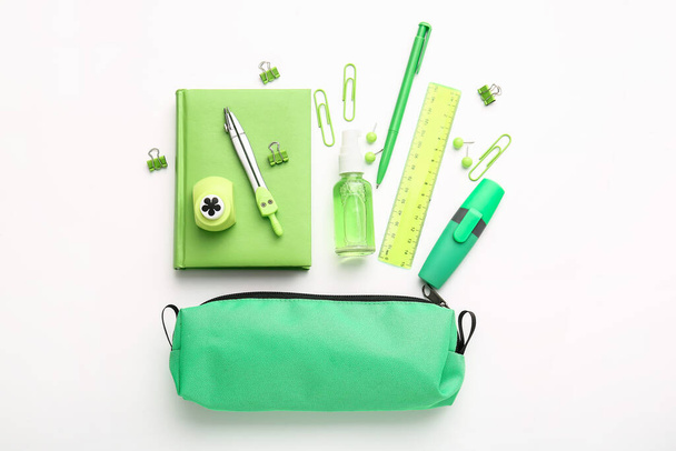 Pencil case with stationery on white background - Photo, Image