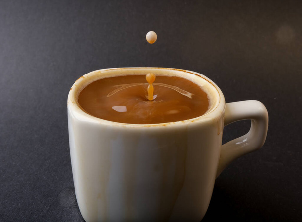 closeup photo of coffee drop in a cup - Photo, Image