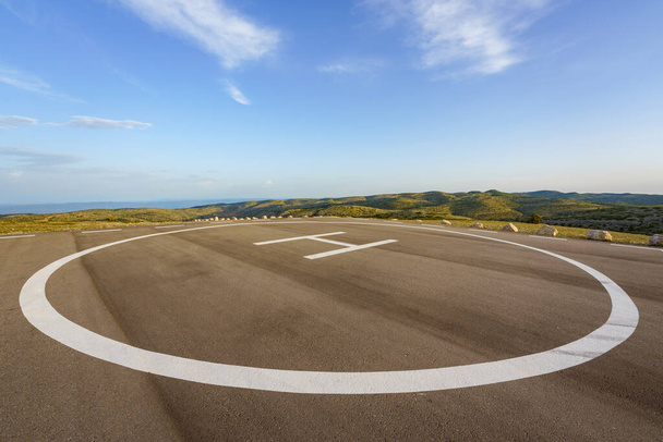 Empty heliport on top of a peak in a countryside remote location - Photo, Image