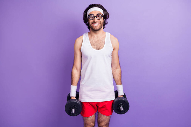 Photo of optimistic brunette guy do sport wear big spectacles white singlet red shirts isolated on lilac color background - Foto, imagen
