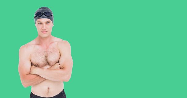 Composition of male swimmer with copy space isolated on green background. sports and competition concept digitally generated image. - Foto, immagini