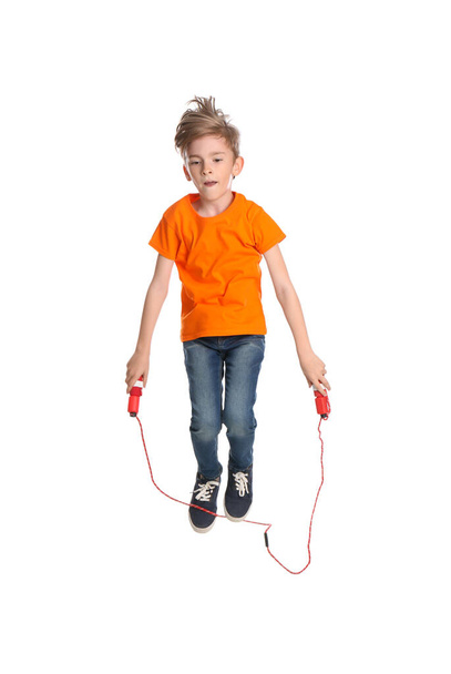 Cute little boy with jump rope on white background - Φωτογραφία, εικόνα