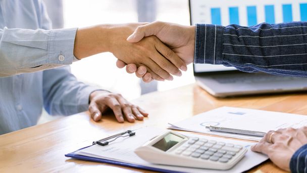 handshaking of agreement to make a contract starting new financial business. - Photo, Image