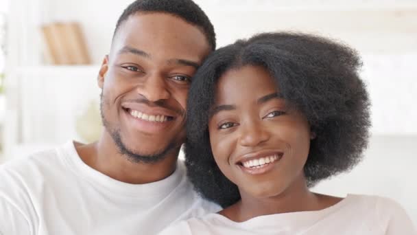 Webcam view happy loving african american married couple newlyweds afro family curly beautiful woman and ethnic black man hugging cuddling talking on video call conference online smiling videocalling - Imágenes, Vídeo