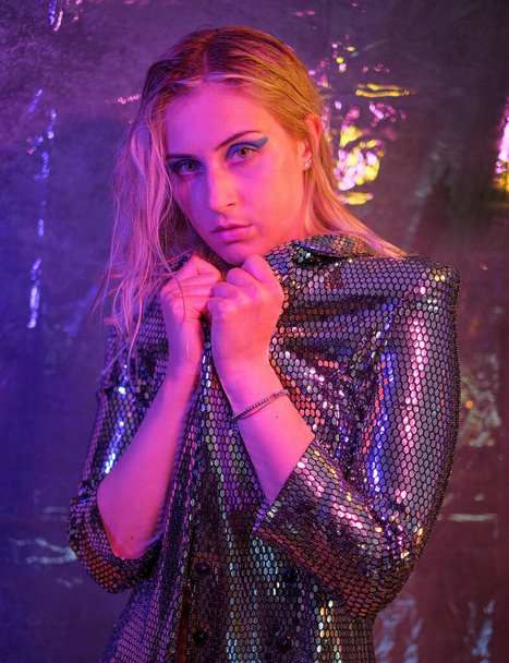 beautiful blonde italian girl posing in photo studio with colorful lights High quality photo - Zdjęcie, obraz