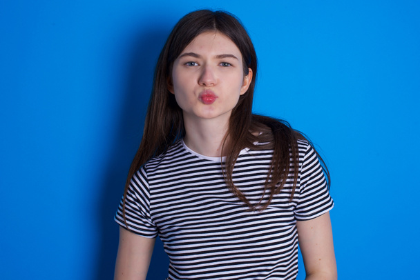 Portrait of lovely funny young woman sending air kiss - Photo, Image