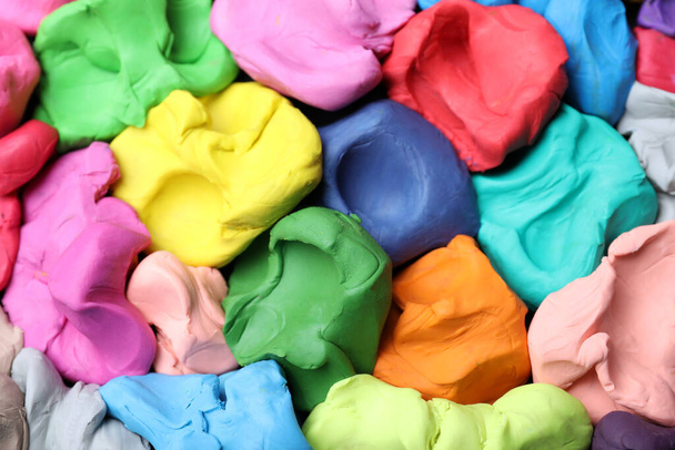 Pile of colorful plasticine as background, top view - Foto, immagini