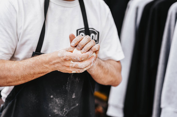 Chef hands with piece of dough for making pizza - Fotografie, Obrázek