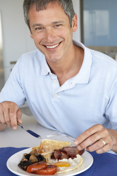 Middle Aged Man Eating Unhealthy Fried Breakfast - Fotó, kép