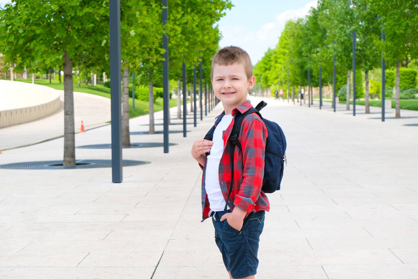 Schoolboy on the street on the way to school. Back to school.  - Fotoğraf, Görsel