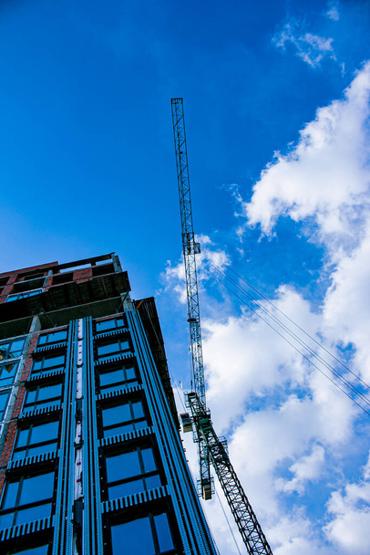 Crane and building construction. Construction of a large building - Photo, Image
