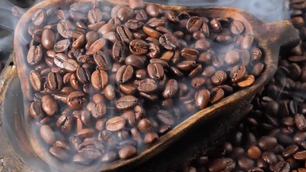 Roasted coffee beans slowly smoking in a plate - Footage, Video