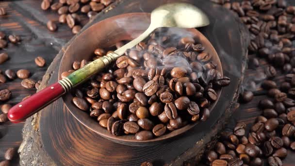 Roasted coffee beans slowly smoking in a plate - Footage, Video