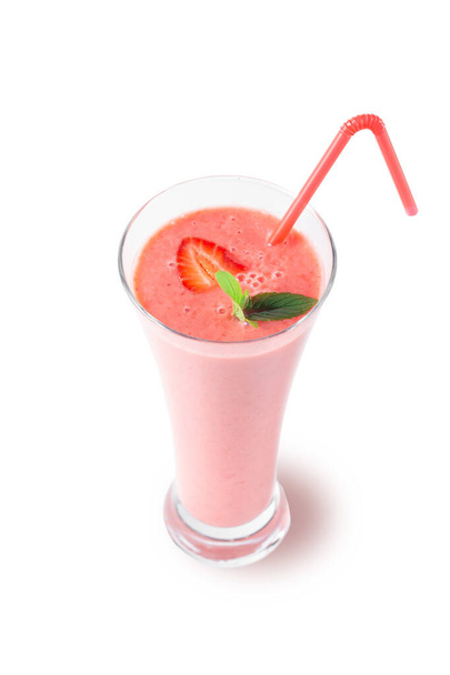 Fresh strawberry milkshake decorated with berries and mint on a white isolated background, the concept of a healthy breakfast, diet and good nutrition.  - Foto, immagini