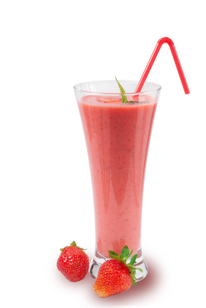 Fresh strawberry milkshake decorated with berries and mint on a white isolated background, the concept of a healthy breakfast, diet and good nutrition.  - Фото, зображення