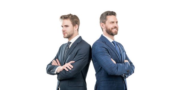 zwei selbstbewusste Geschäftspartner im Anzug kreuzen die Hände auf weißem Grund, Partnerschaft - Foto, Bild